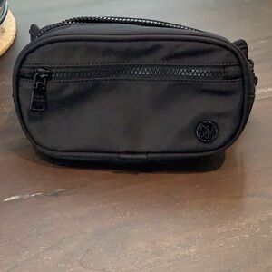 Black Steve Madden pouch bag.